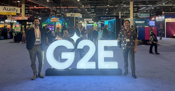 cmx1-reps-standing-at-g2e-sign