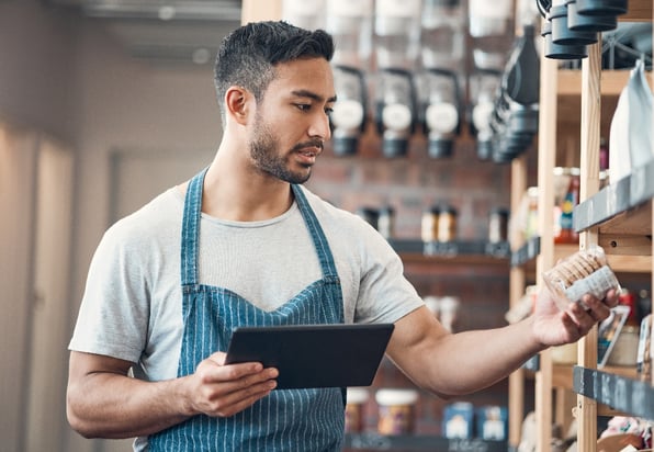 man_conducting_audit_on_food_products