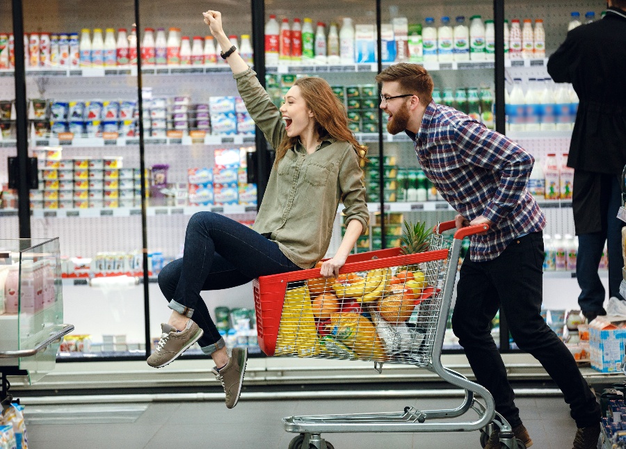 Man and woman grocery store in cart-1