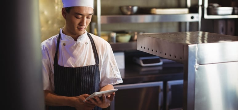 Restaurant Operations Asian Man with Tablet in kitchen-1-4